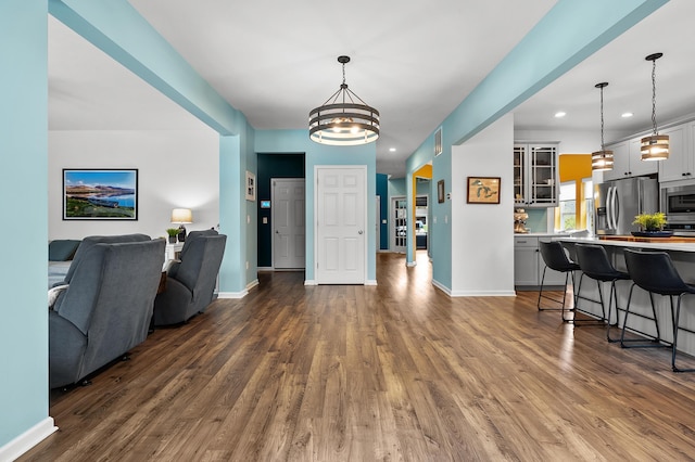 5849 Gavin Ln, Kalamazoo, MI 49009 - interior space featuring a chandelier, dark wood-type flooring, and recessed lighting