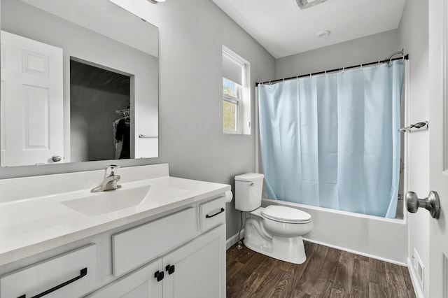 5849 Gavin Ln, Kalamazoo, MI 49009 - full bath with shower / bath combination with curtain, toilet, wood finished floors, visible vents, and vanity