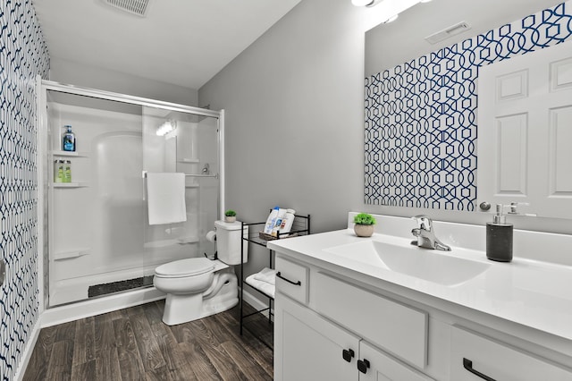 5849 Gavin Ln, Kalamazoo, MI 49009 - bathroom with toilet, visible vents, wallpapered walls, and a shower stall