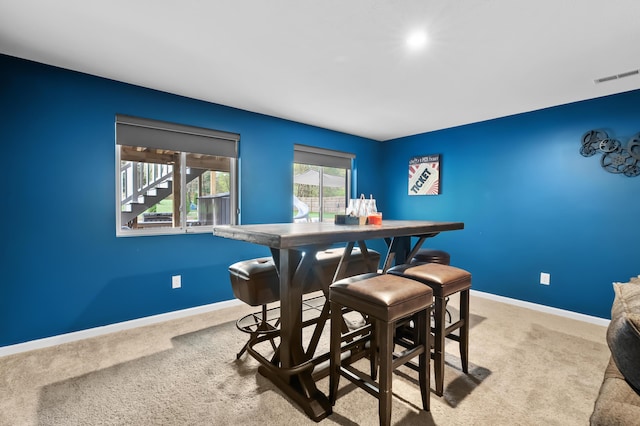 5849 Gavin Ln, Kalamazoo, MI 49009 - carpeted dining area featuring baseboards and visible vents