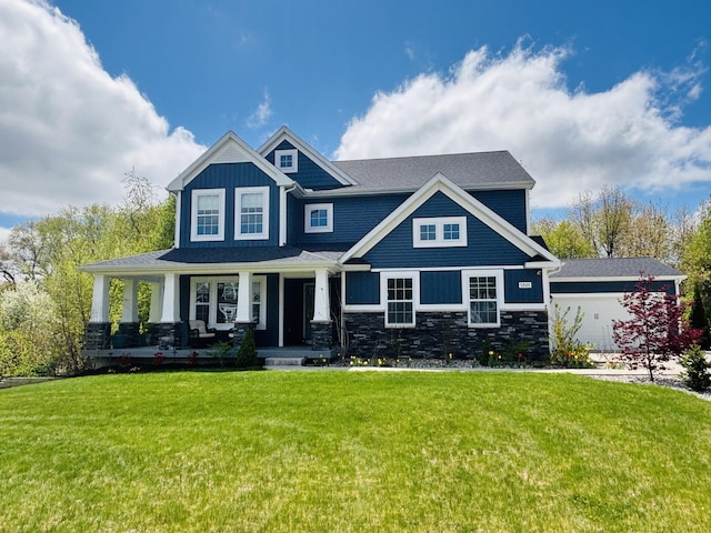 5849 Gavin Ln, Kalamazoo, MI 49009 - craftsman inspired home featuring stone siding, a porch, a front yard, and board and batten siding