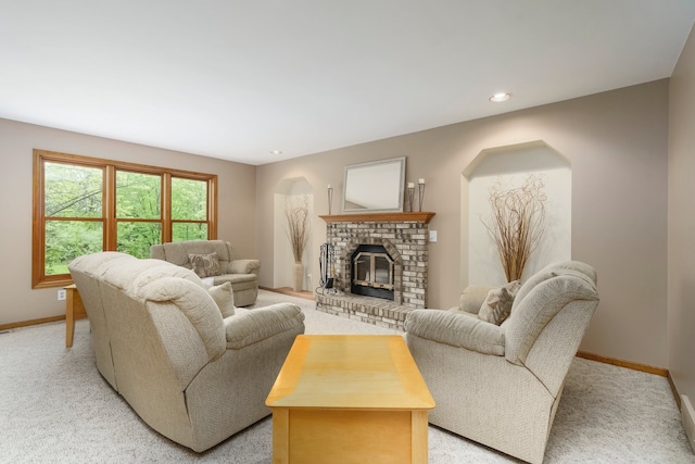 4217 Phillips Rd, Metamora, MI 48455 - living area with baseboards, light colored carpet, a fireplace, arched walkways, and recessed lighting