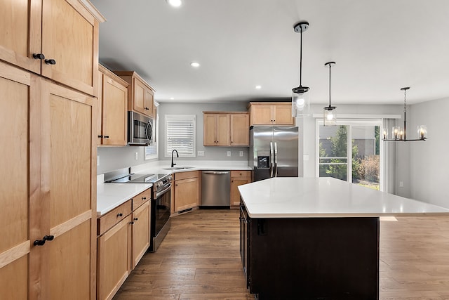 4125 Newton Rd, Commerce Twp, MI 48390 - kitchen featuring stainless steel appliances, light brown cabinetry, a sink, recessed lighting, and a center island