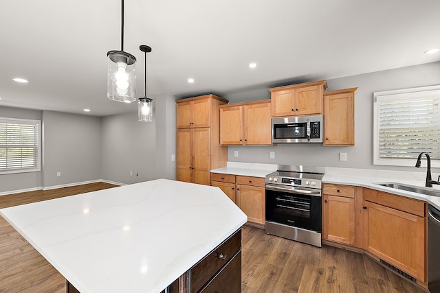 4125 Newton Rd, Commerce Twp, MI 48390 - kitchen featuring appliances with stainless steel finishes, a sink, dark wood-style floors, a center island, and recessed lighting