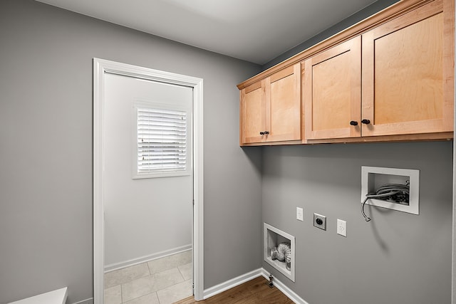 4125 Newton Rd, Commerce Twp, MI 48390 - laundry area with electric dryer hookup, cabinet space, hookup for a washing machine, and baseboards