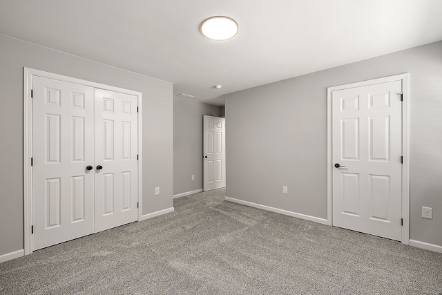 4125 Newton Rd, Commerce Twp, MI 48390 - unfurnished bedroom with carpet floors, baseboards, and a closet