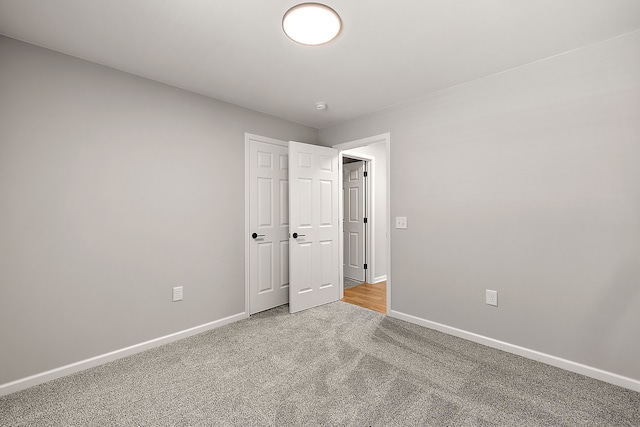 4125 Newton Rd, Commerce Twp, MI 48390 - unfurnished bedroom featuring carpet and baseboards