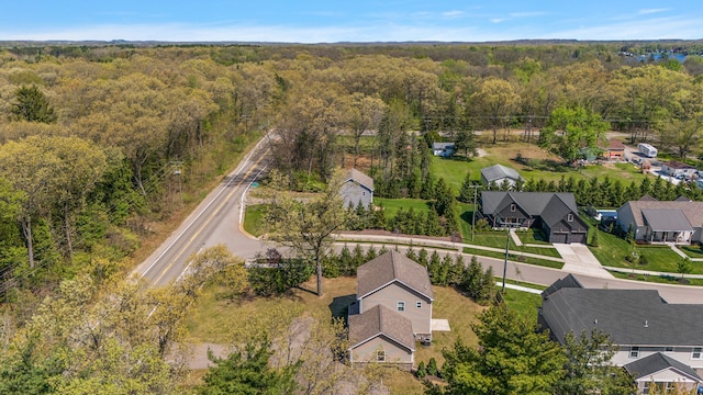 4125 Newton Rd, Commerce Twp, MI 48390 - aerial perspective of suburban area with a forest