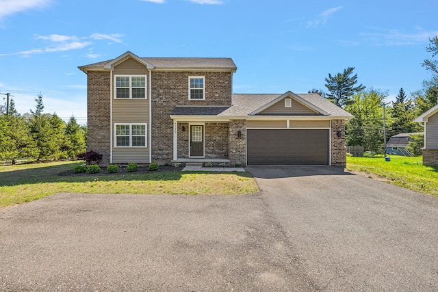 4125 Newton Rd, Commerce Twp, MI 48390 - traditional-style home featuring an attached garage, brick siding, a front yard, and driveway