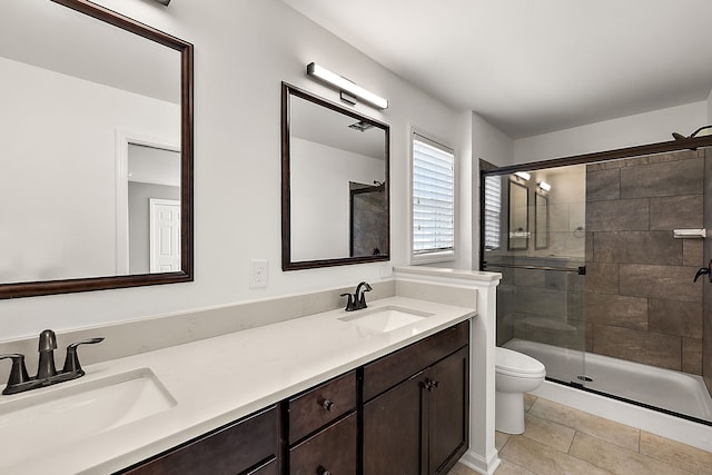 4125 Newton Rd, Commerce Twp, MI 48390 - bathroom with a shower stall, double vanity, toilet, and tile patterned floors