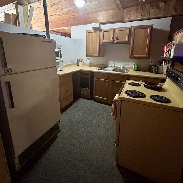 8874 W Houghton Lake Dr, Houghton Lake, MI 48629 - kitchen featuring white appliances, wood ceiling, a sink, dark carpet, and light countertops