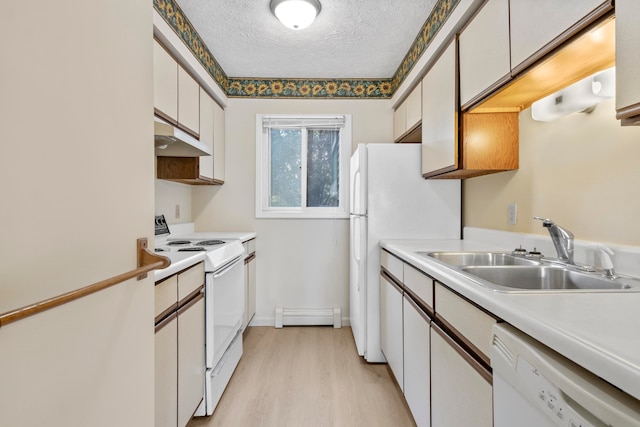 2703 Green Meadows Dr, Traverse City, MI 49685 - kitchen with white appliances, a sink, under cabinet range hood, a textured ceiling, and light wood-style flooring