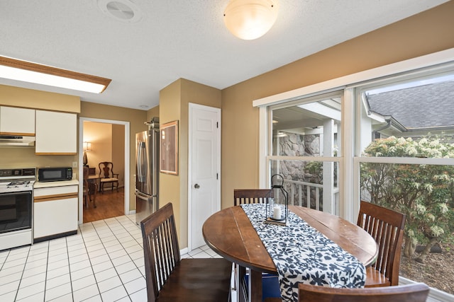 dining area with light tile patterned floors