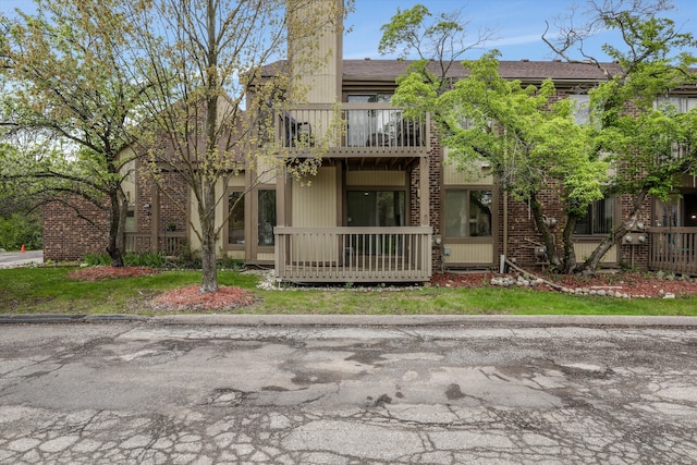 view of front of property with a balcony