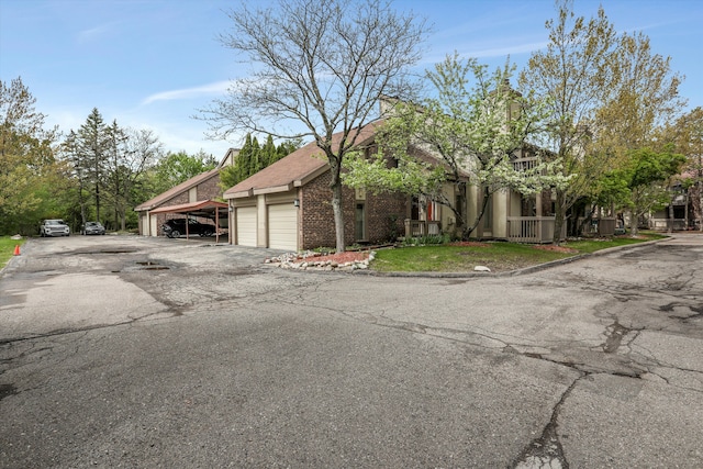 view of front of house with brick siding and an attached garage