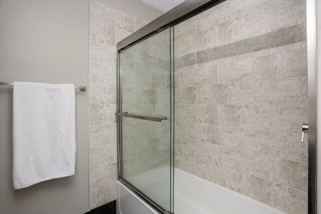 full bath with shower / bath combination with glass door