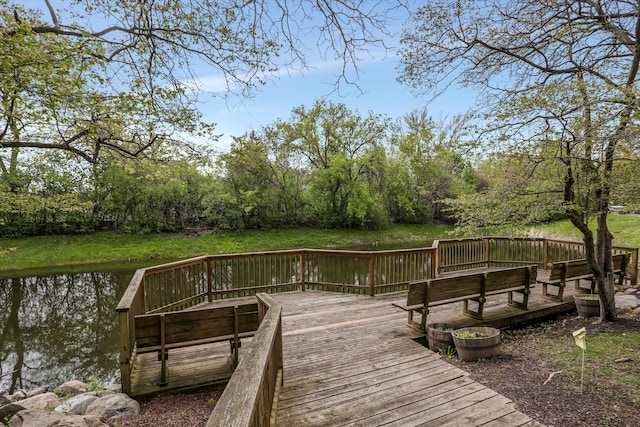 dock featuring a deck with water view