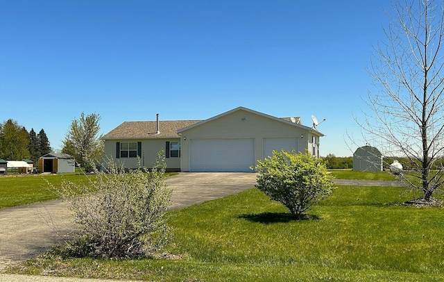 ranch-style house featuring a garage, concrete driveway, and a front yard