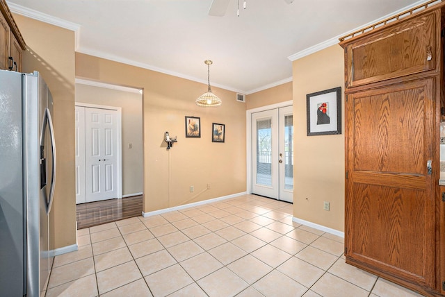 interior space with french doors, visible vents, crown molding, light tile patterned floors, and baseboards