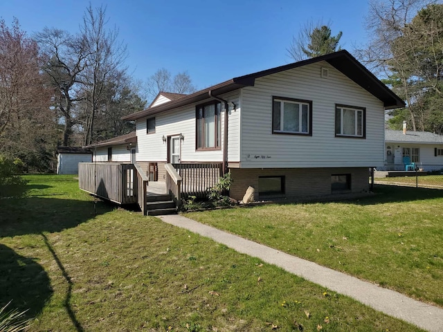 854 Kelley St, Traverse City, MI 49686 - rear view of property with a deck and a lawn