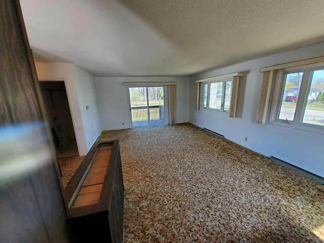 854 Kelley St, Traverse City, MI 49686 - carpeted spare room featuring a textured ceiling