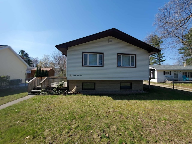 854 Kelley St, Traverse City, MI 49686 - view of side of property with a wooden deck
