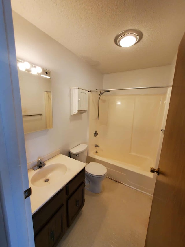 854 Kelley St, Traverse City, MI 49686 - bathroom with a textured ceiling, vanity, toilet, and bathing tub / shower combination