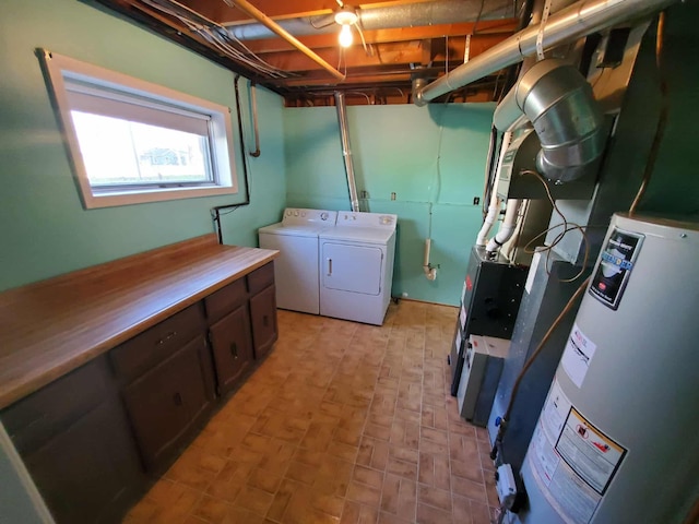 854 Kelley St, Traverse City, MI 49686 - laundry area featuring separate washer and dryer, cabinet space, and gas water heater