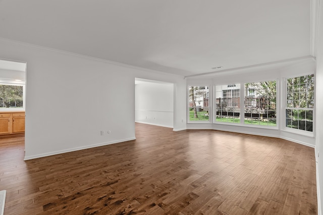 2658 Williamsburg Cir Unit 47, Auburn Hills, MI 48326 - unfurnished living room featuring healthy amount of natural light, crown molding, dark wood-style floors, and baseboards
