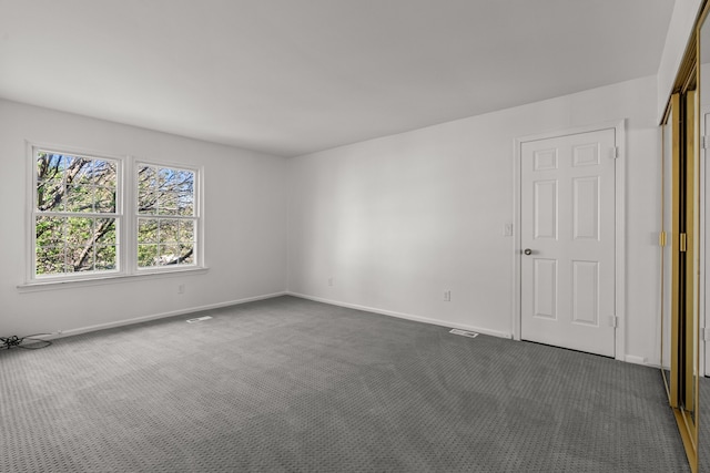 2658 Williamsburg Cir Unit 47, Auburn Hills, MI 48326 - empty room with dark carpet and baseboards
