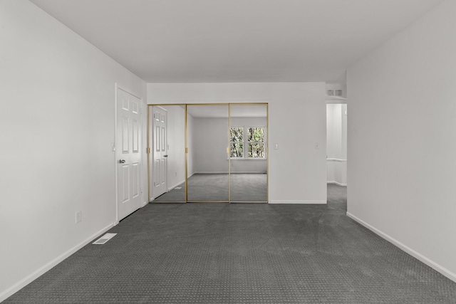 2658 Williamsburg Cir Unit 47, Auburn Hills, MI 48326 - unfurnished room with dark colored carpet and baseboards