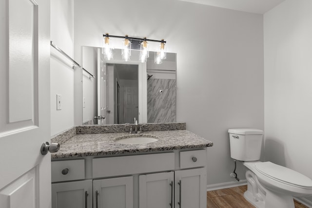 2658 Williamsburg Cir Unit 47, Auburn Hills, MI 48326 - bathroom featuring wood finished floors, toilet, and vanity