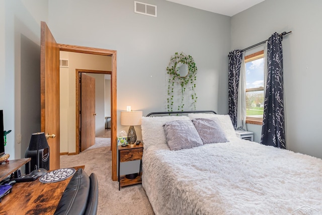 bedroom with visible vents and carpet floors