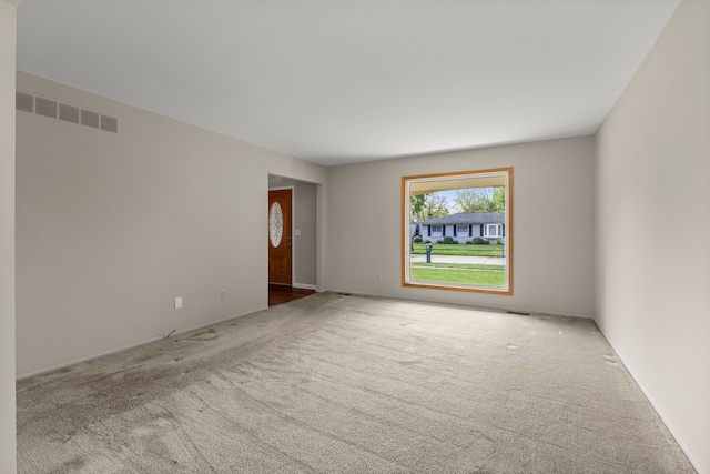 spare room with carpet floors