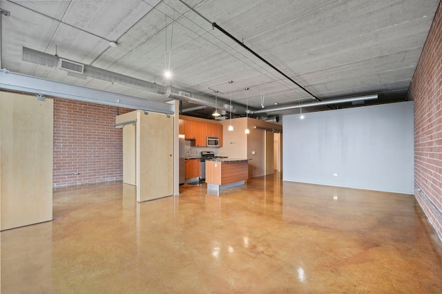 basement featuring brick wall