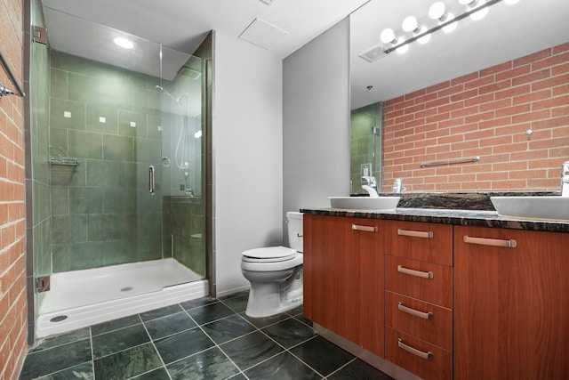 full bathroom featuring toilet, a stall shower, tile patterned flooring, and vanity