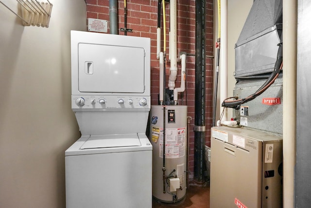 washroom with stacked washer / drying machine, water heater, and heating unit