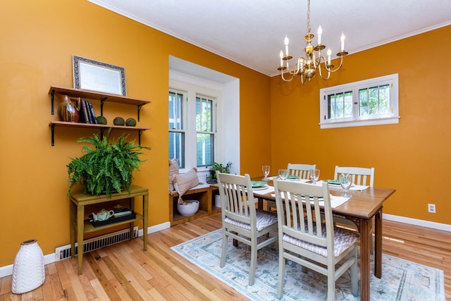 320 E Farnum Ave, Royal Oak, MI 48067 - dining area featuring crown molding, wood finished floors, a chandelier, plenty of natural light, and baseboards