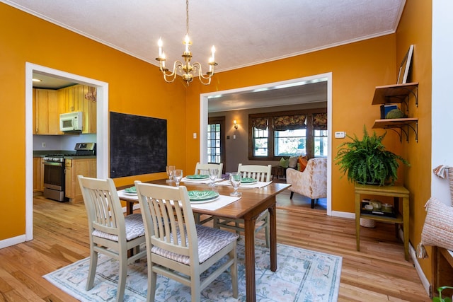 320 E Farnum Ave, Royal Oak, MI 48067 - dining room featuring a chandelier, light wood finished floors, crown molding, and baseboards