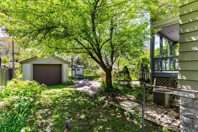 320 E Farnum Ave, Royal Oak, MI 48067 - view of yard featuring an outbuilding, a garage, fence, and a storage shed