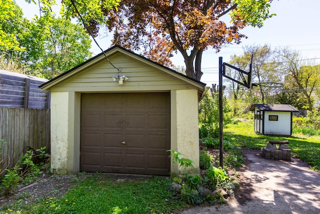 320 E Farnum Ave, Royal Oak, MI 48067 - detached garage featuring fence, driveway, and a storage unit