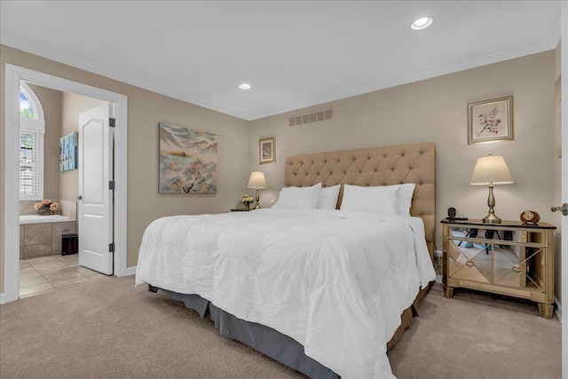 carpeted bedroom with recessed lighting, crown molding, baseboards, and ensuite bathroom