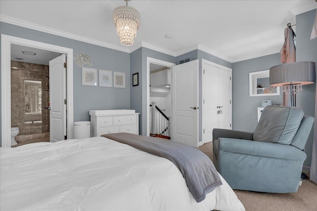 carpeted bedroom with a chandelier, ensuite bath, and ornamental molding