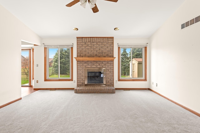 unfurnished living room featuring vaulted ceiling, ceiling fan, carpet floors, and baseboards