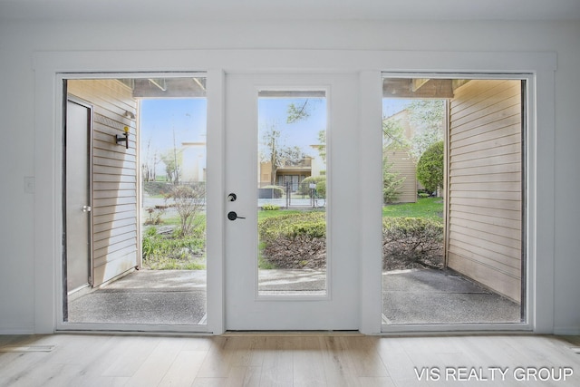doorway featuring wood finished floors