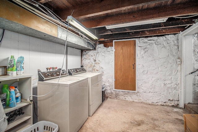 clothes washing area with washer and dryer and laundry area