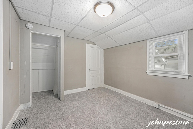 1108/1110 Muskegon Ave NW, Grand Rapids, MI 49504 - unfurnished bedroom with a paneled ceiling, carpet, baseboards, and a closet