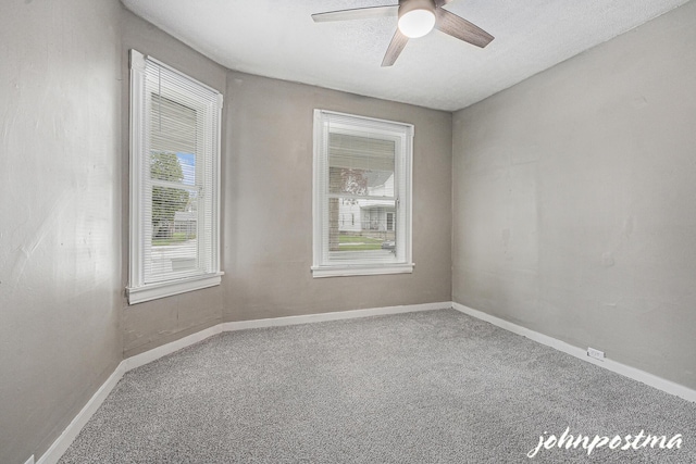 1108/1110 Muskegon Ave NW, Grand Rapids, MI 49504 - unfurnished room featuring a ceiling fan, baseboards, and carpet floors
