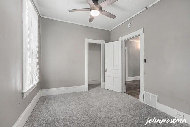 1108/1110 Muskegon Ave NW, Grand Rapids, MI 49504 - unfurnished bedroom with carpet, a ceiling fan, crown molding, visible vents, and baseboards