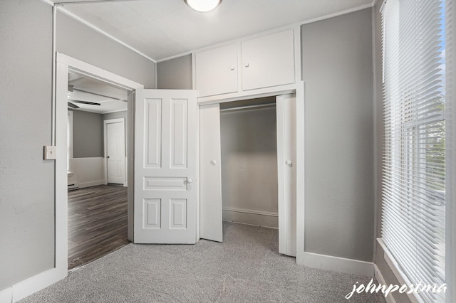 1108/1110 Muskegon Ave NW, Grand Rapids, MI 49504 - unfurnished bedroom featuring a baseboard radiator, carpet flooring, baseboards, and a closet